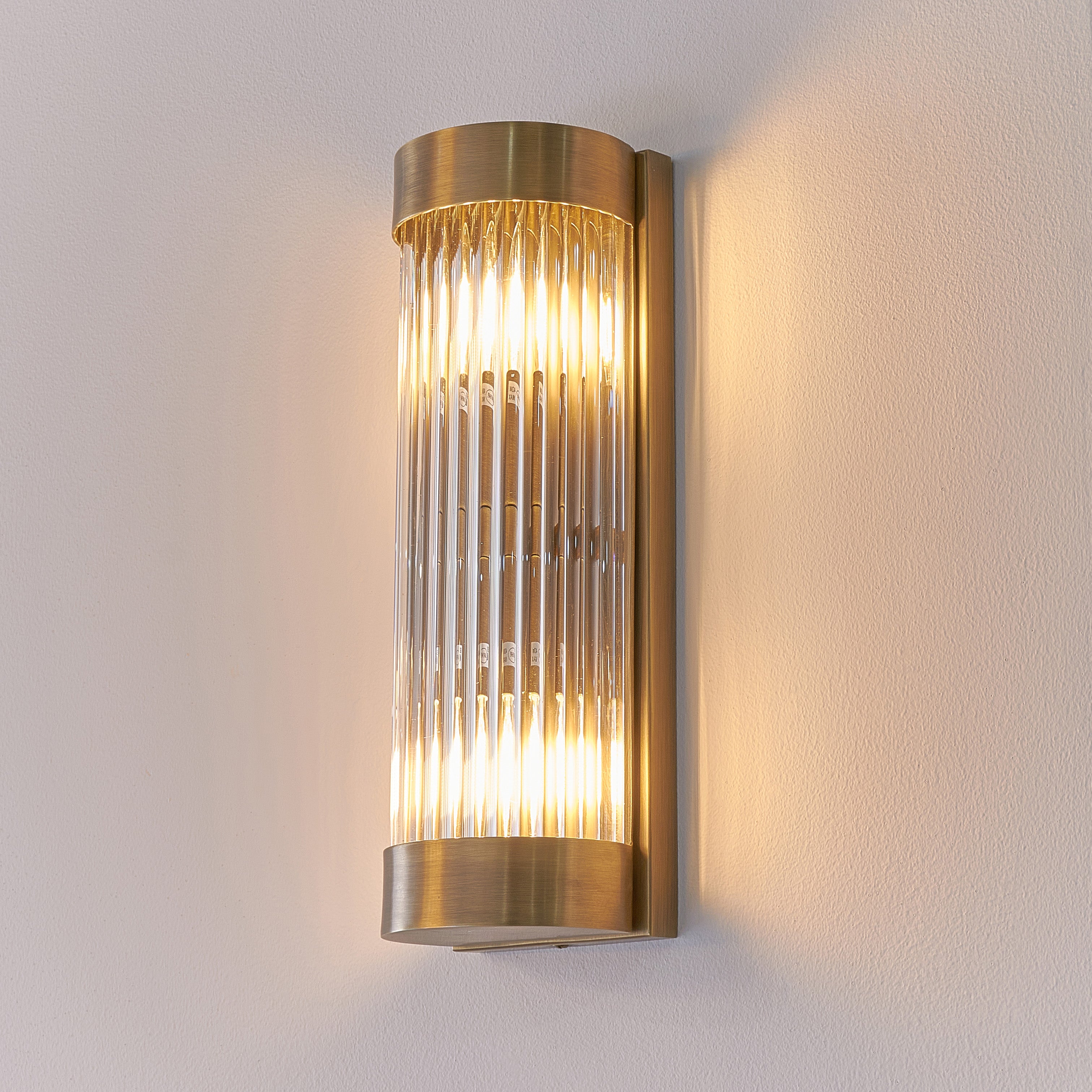 Nasir Antique Brass Wall Light with Glass Rods Shade by RV Astley