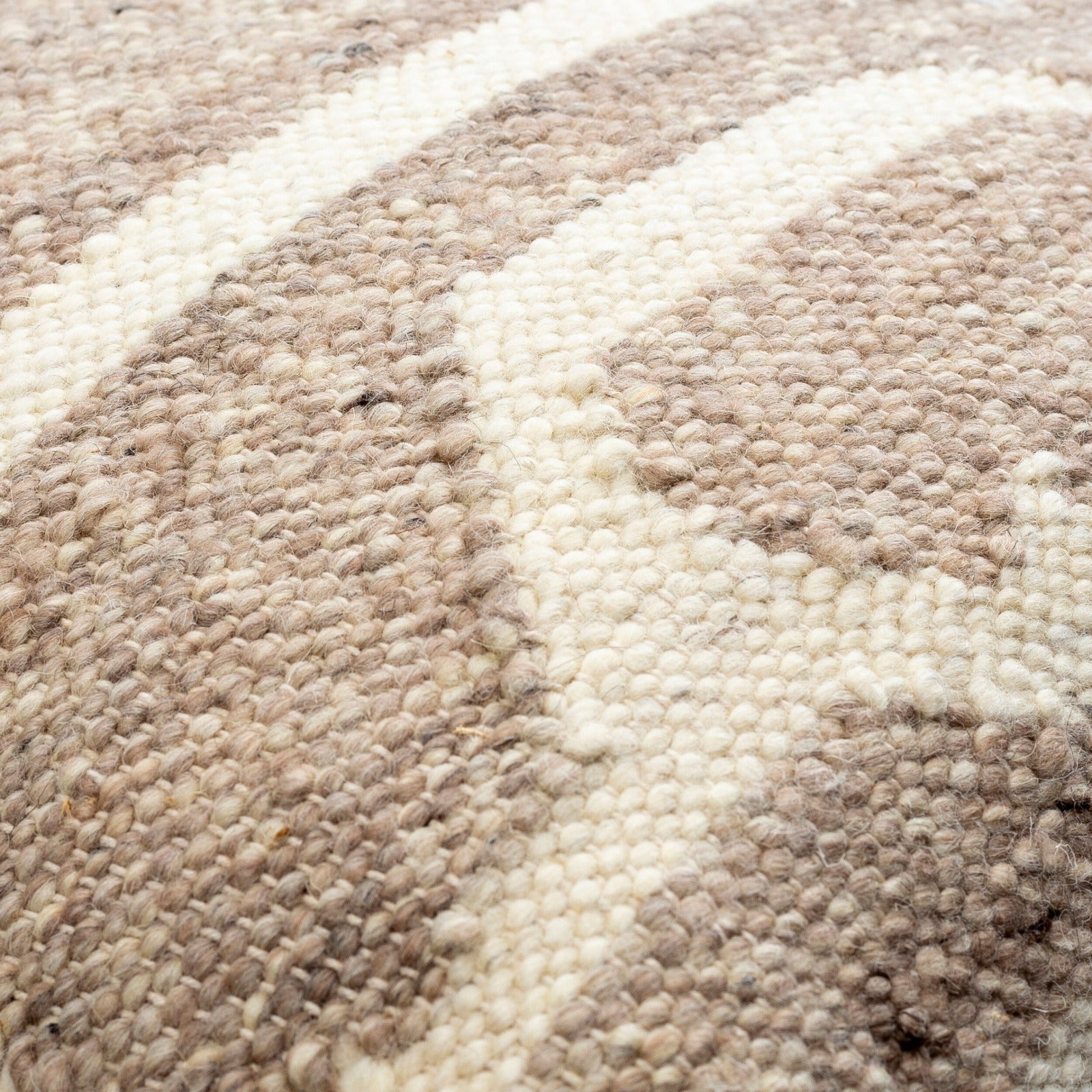 Deccan Traps Woven Cushion in Beige by Keiichi