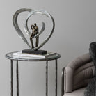 Love Sculpture In Circular Heart by Libra Interiors