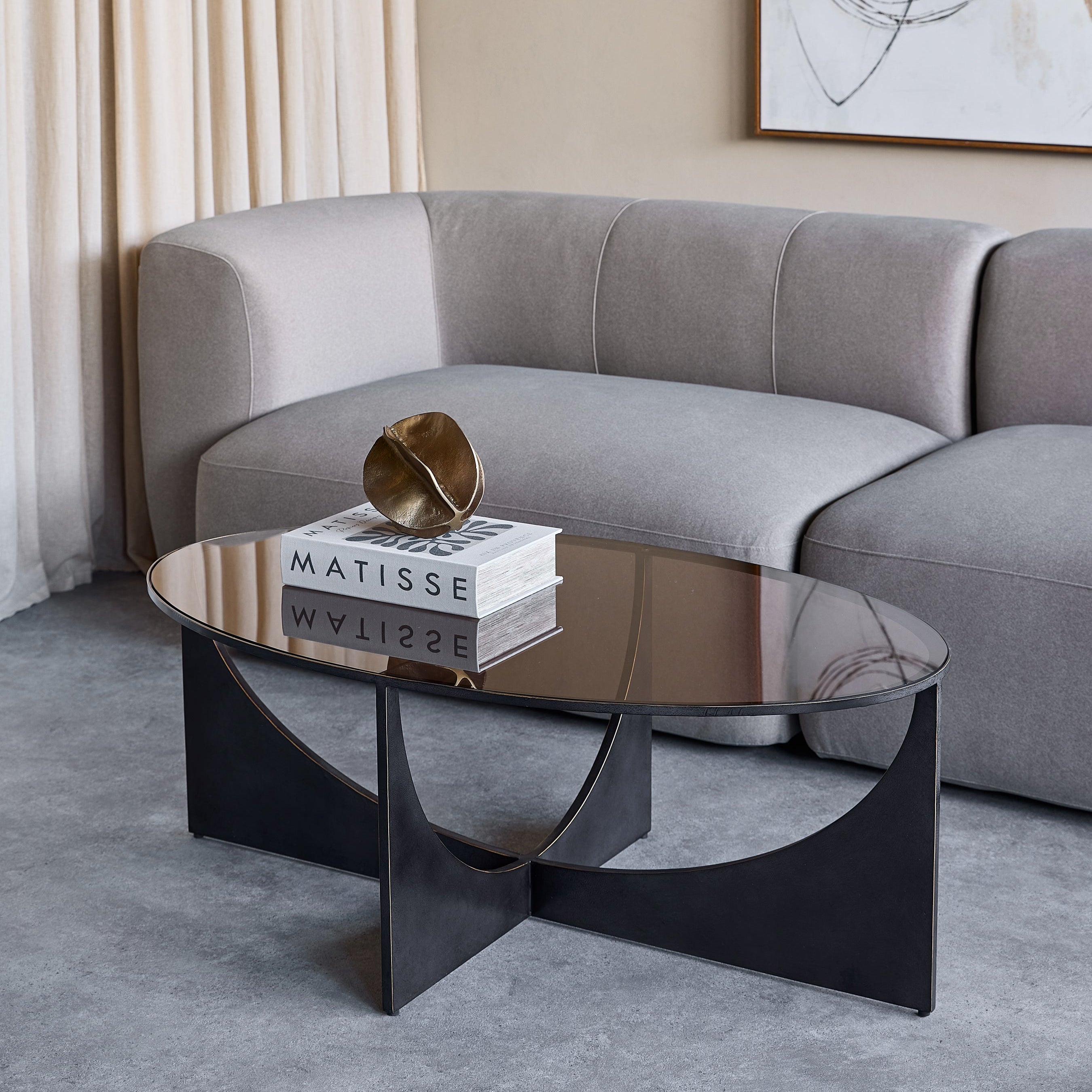Glenthorpe Black & Bronze Sculpted Coffee Table with Glass Top by Libra Interiors